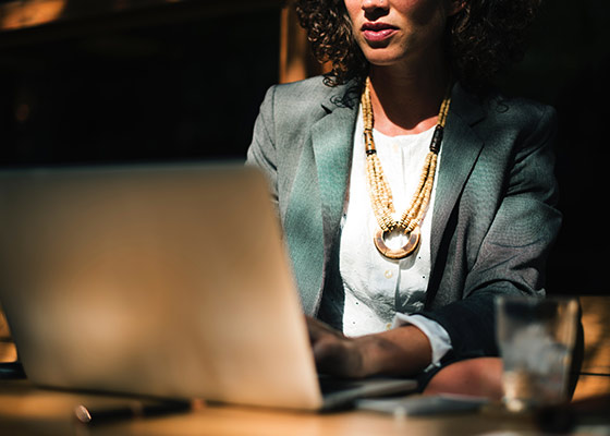 businesswoman sitting at laptop